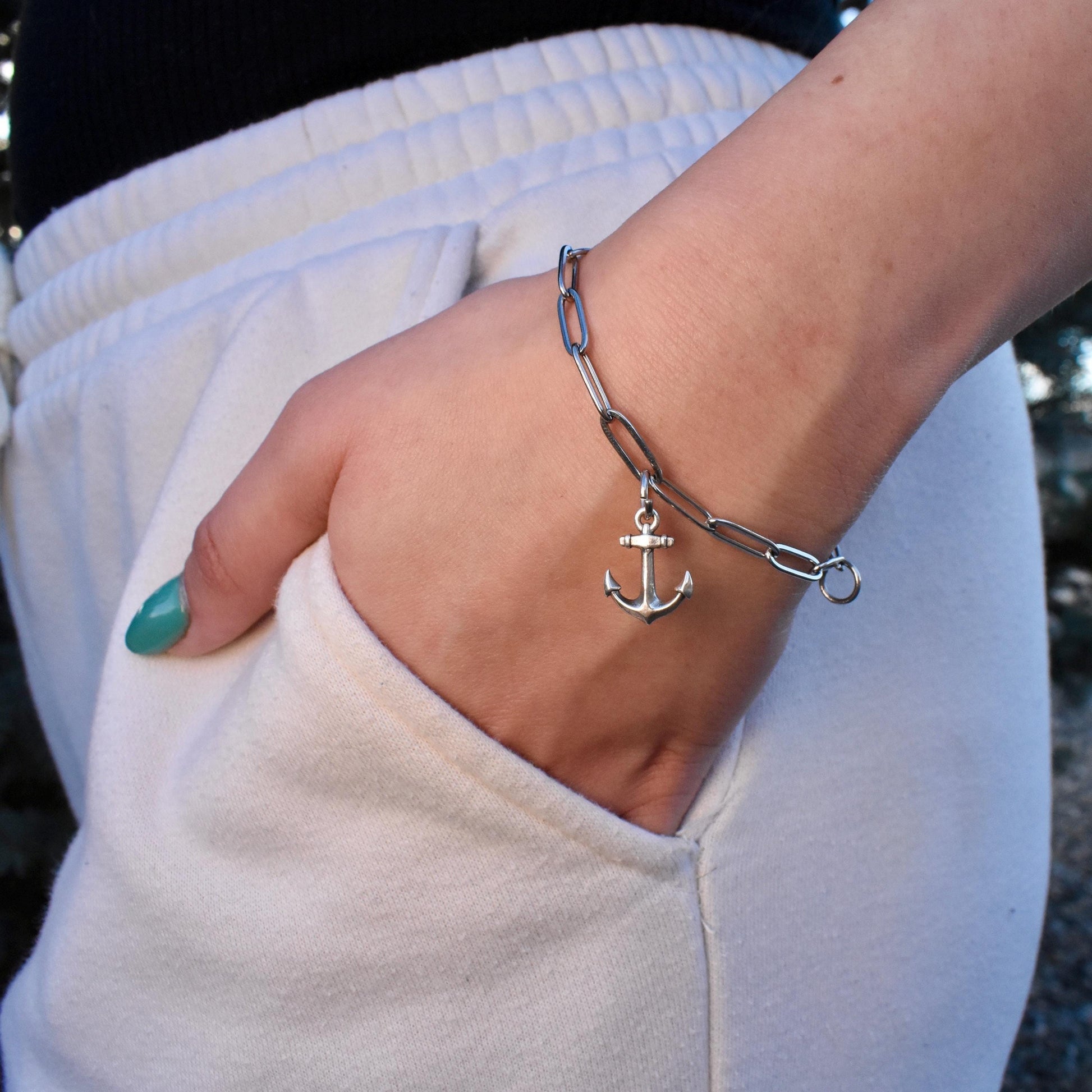 A Woman Wearing A Dainty Anchor Charm on a Bracelet - Handcrafted .925 Sterling Silver Pendant for Bracelets and earrings by The Colorado Charm Company