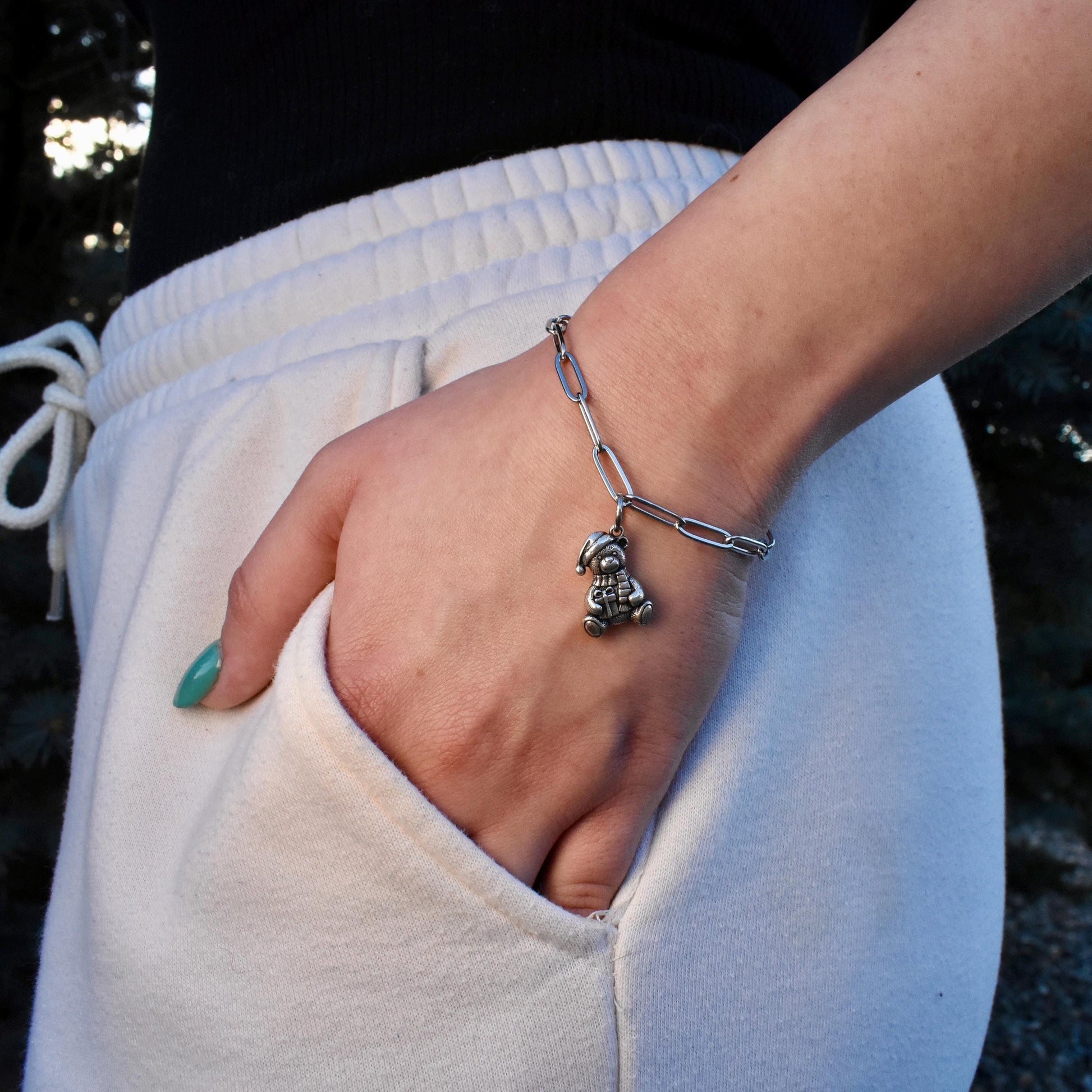 A Woman Wearing a Christmas teddy bear Charm on a bracelet - Handcrafted .925 Sterling Silver Pendant for Bracelets and earrings by The Colorado Charm Company