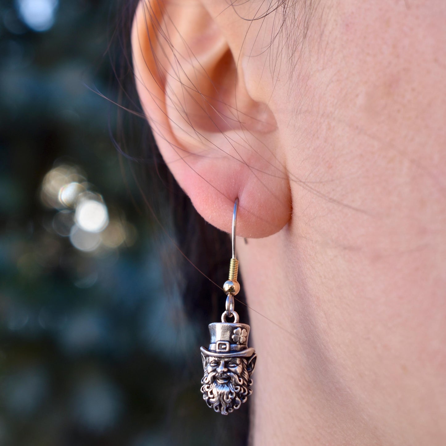 A Woman Wearing A smiling Irish leprechaun Charm Earrings  - Handcrafted .925 Sterling Silver Pendant for Bracelets and earrings by The Colorado Charm Company