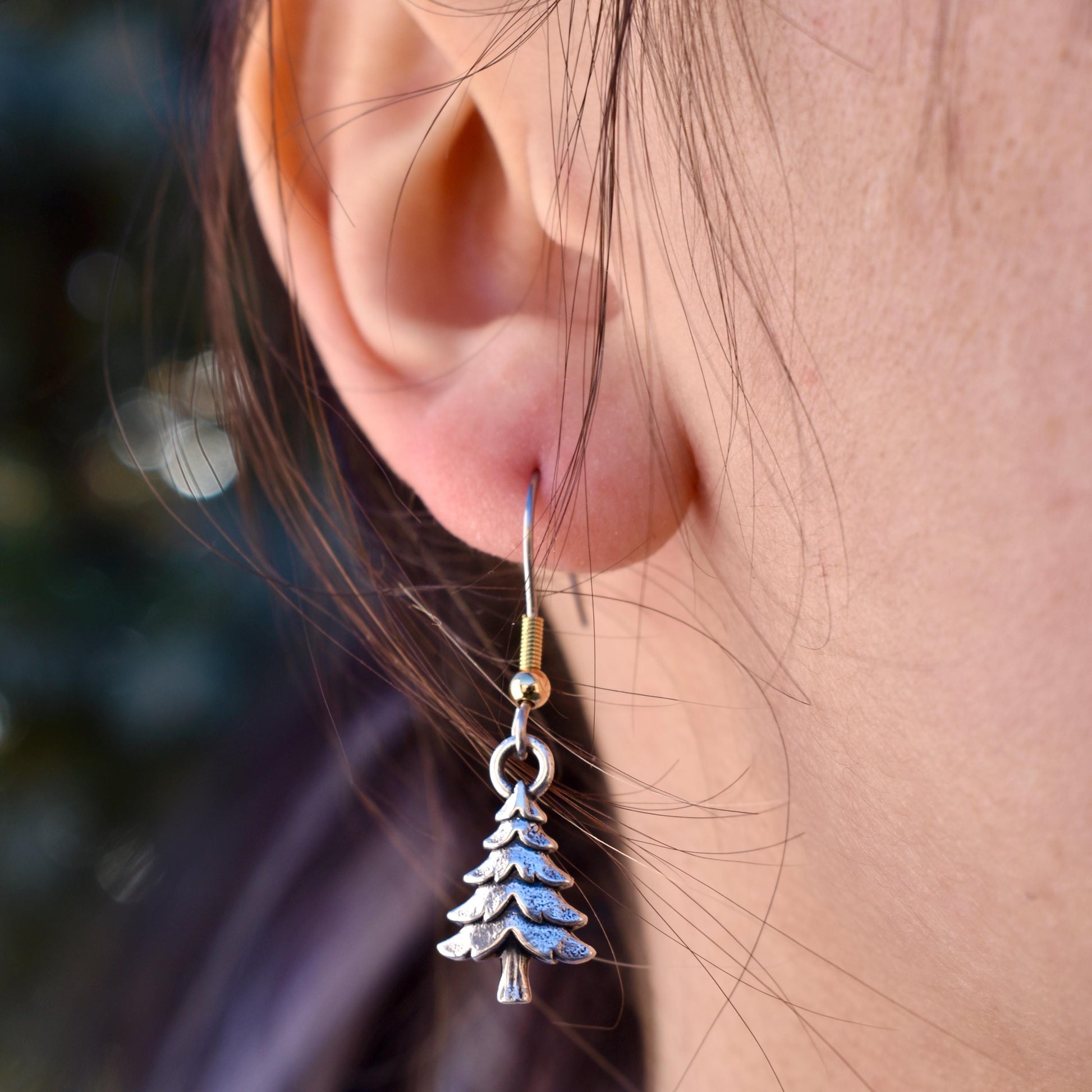 a woman wearing a pine tree charm earrings - Handcrafted .925 Sterling Silver Pendant for Bracelets and earrings by The Colorado Charm Company