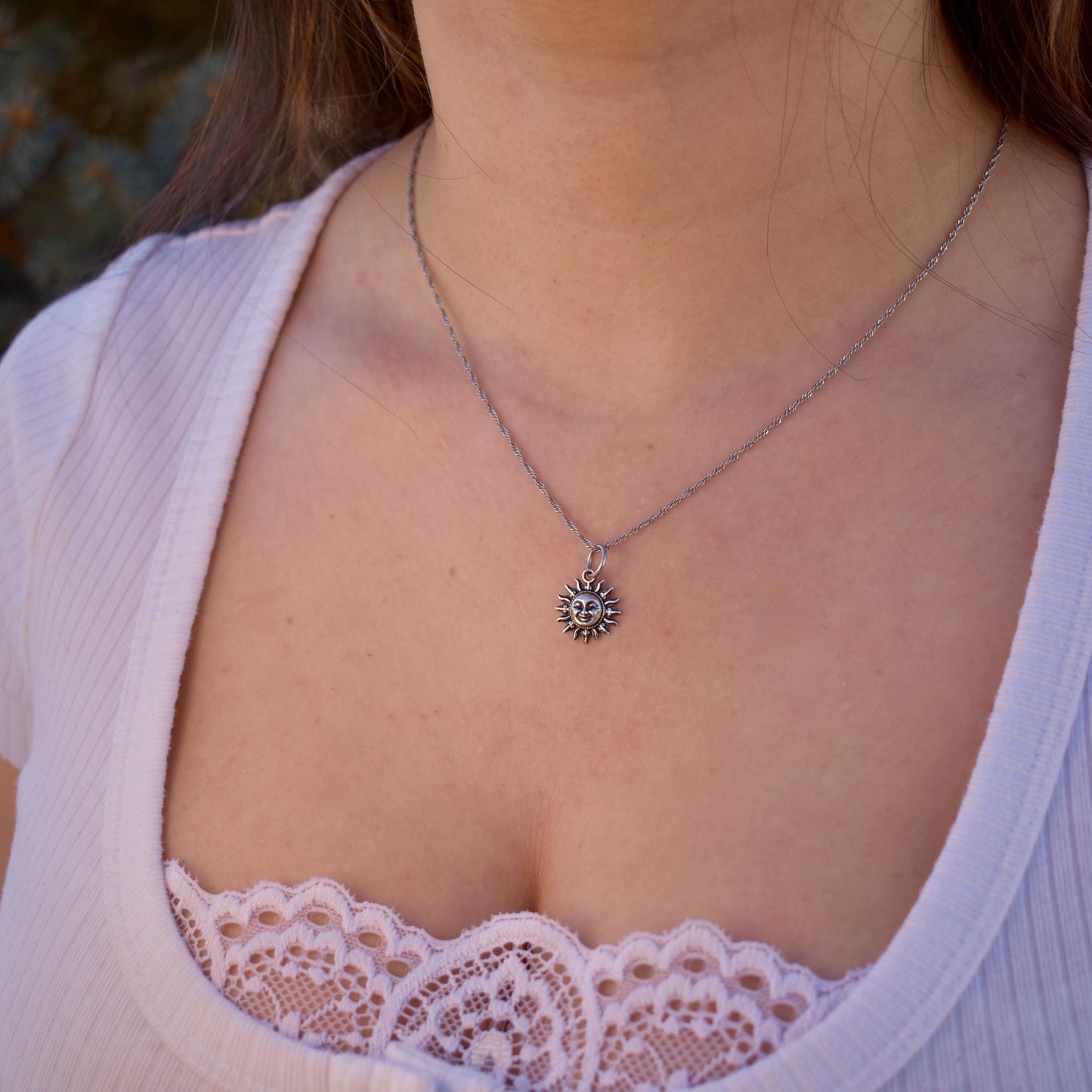 A Woman Wearing A smiling Sun Charm On a Necklace - Handcrafted .925 Sterling Silver Pendant for Bracelets and earrings by The Colorado Charm Company