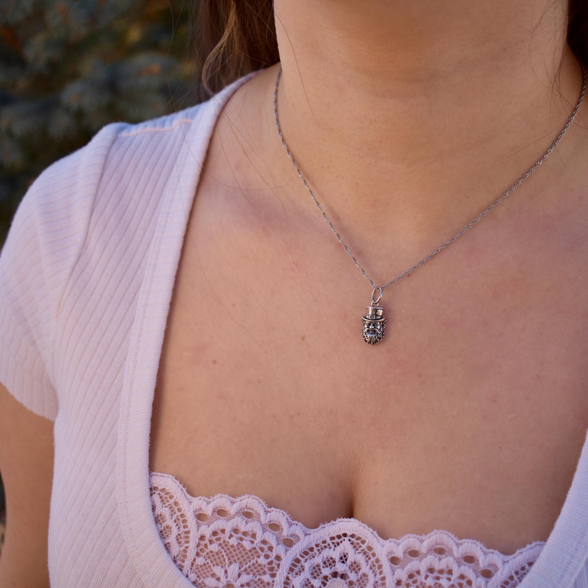 A Woman Wearing A smiling Irish leprechaun Charm On a Necklace - Handcrafted .925 Sterling Silver Pendant for Bracelets and earrings by The Colorado Charm Company 