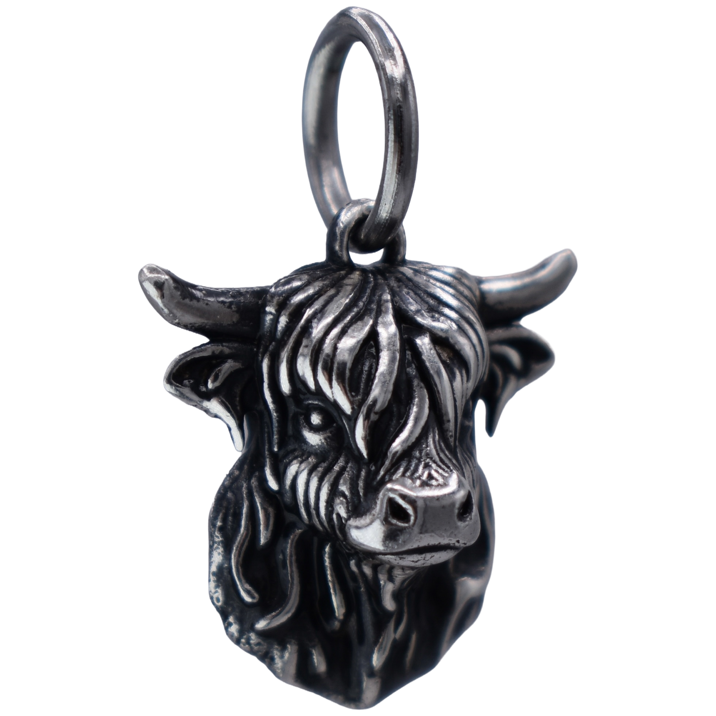 a detailed highland cow Charm - Handcrafted .925 Sterling Silver Pendant for Bracelets and earrings by The Colorado Charm Company - left view