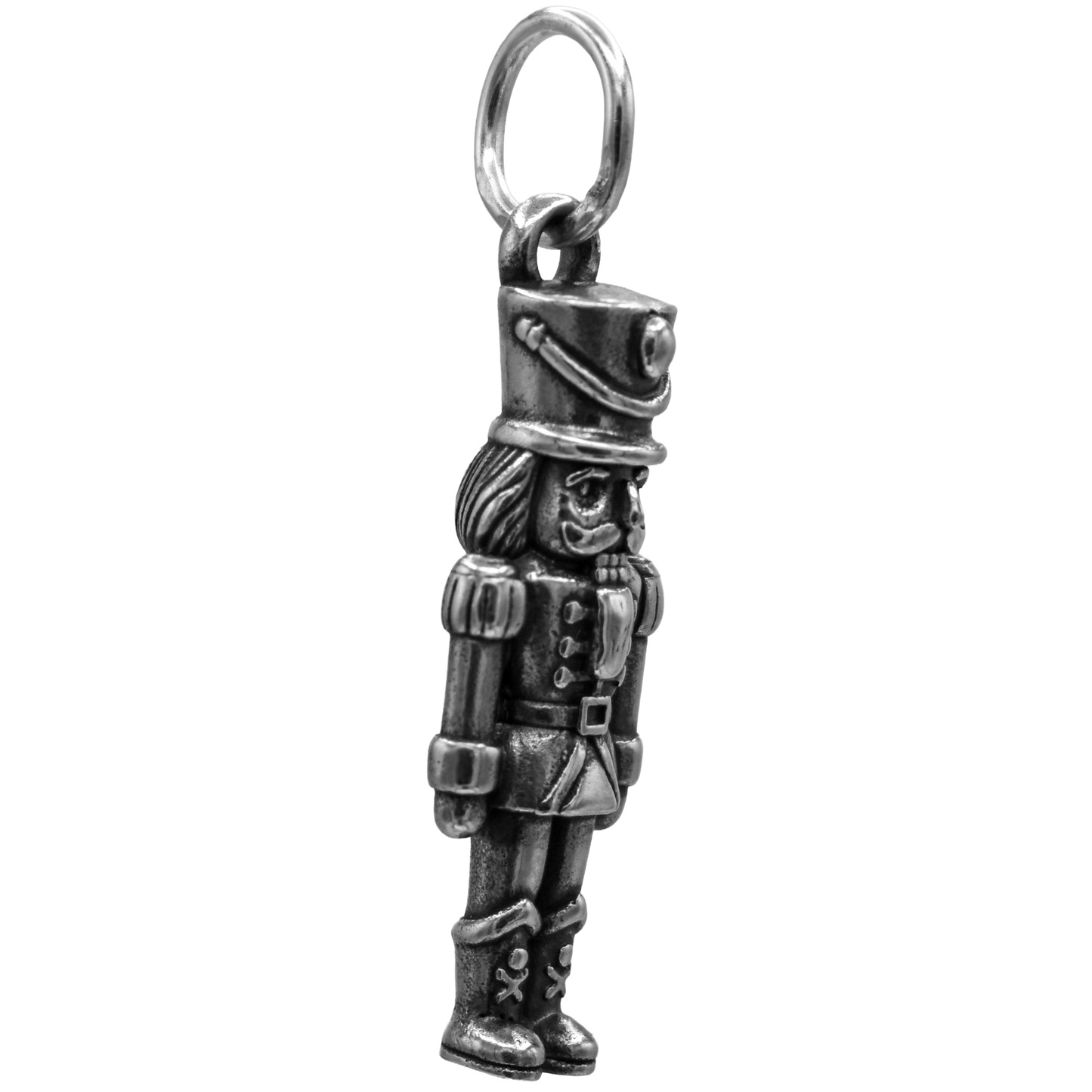 A Classic Nutcracker Charm - Handcrafted .925 Sterling Silver Pendant for Bracelets and earrings by The Colorado Charm Company - left side view