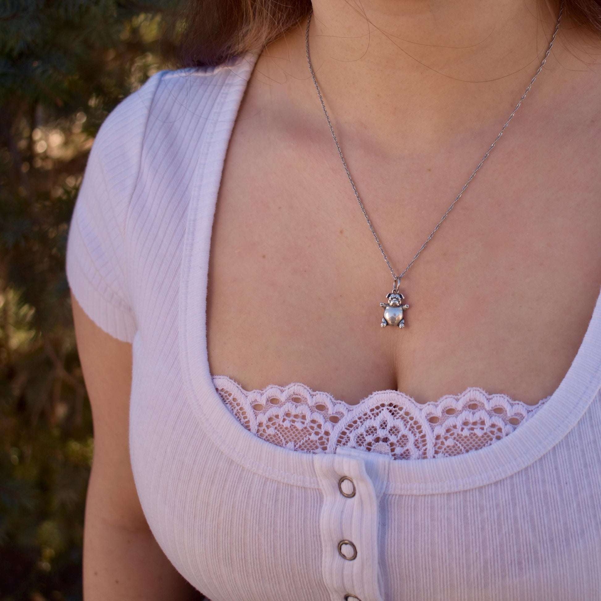 a woman wearing a pibble meme Charm on a necklace - Handcrafted .925 Sterling Silver Pendant for Bracelets and earrings by The Colorado Charm Company